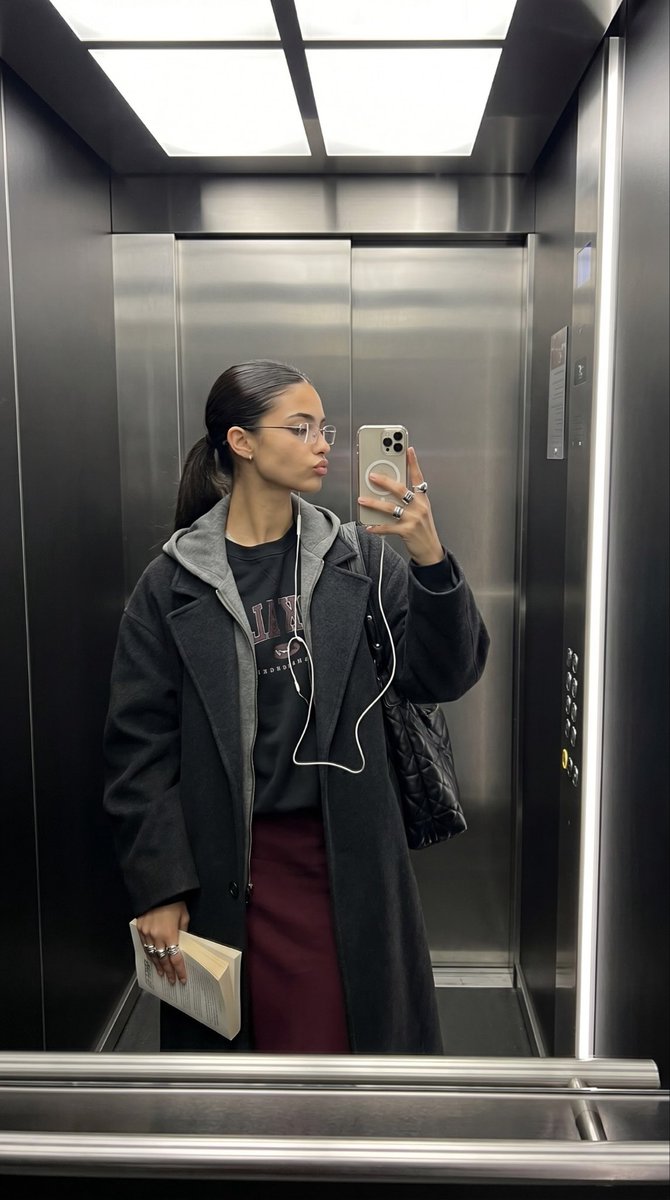 Elevator Mirror Selfie with Book