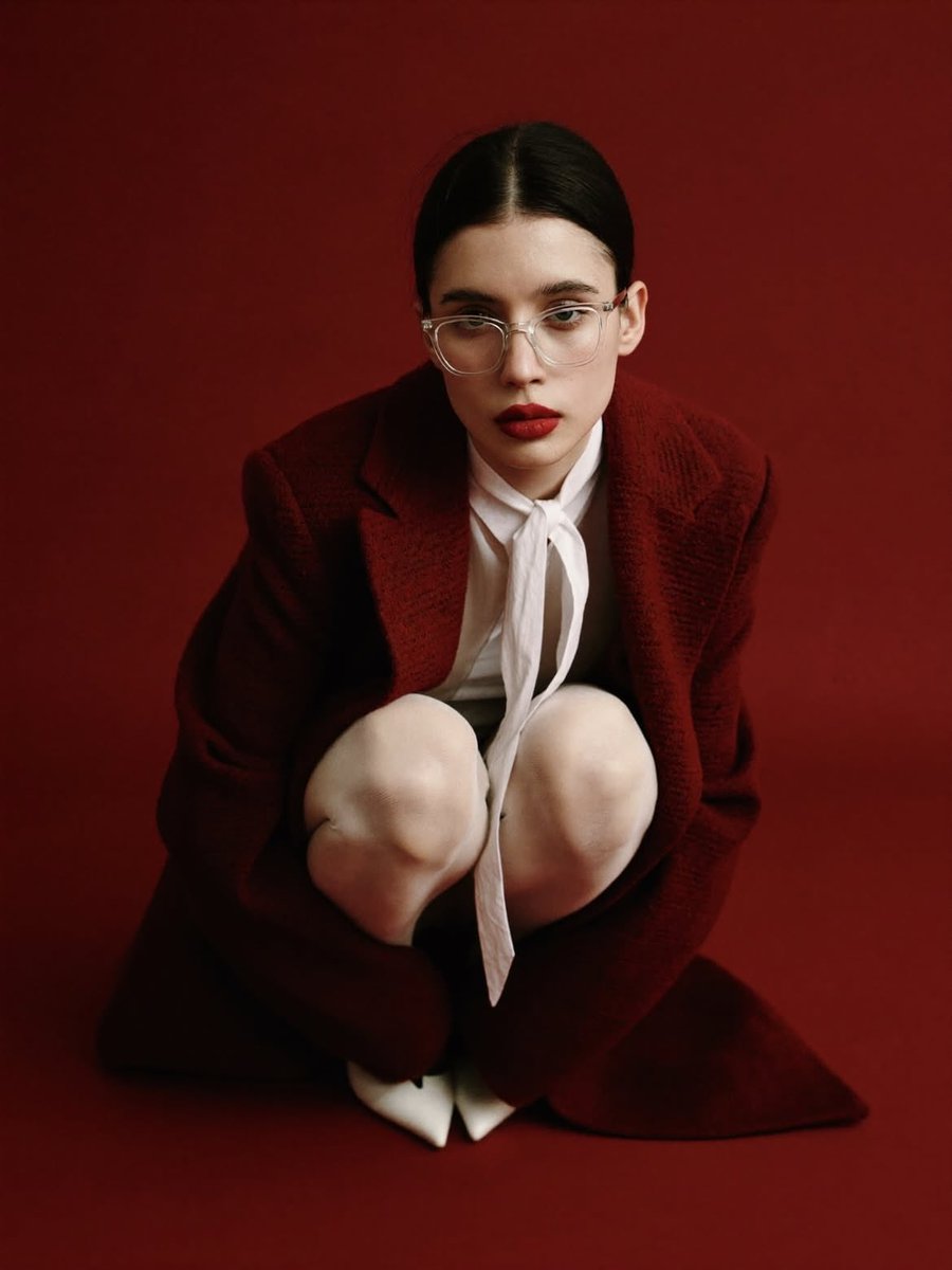 High-Fashion Editorial Portrait with Red Background